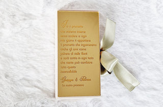 White box with gold initials plaque application