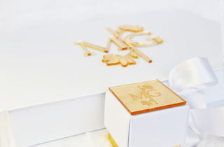 White box with flower and engraved wedding tag